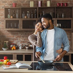 A couple cooking together